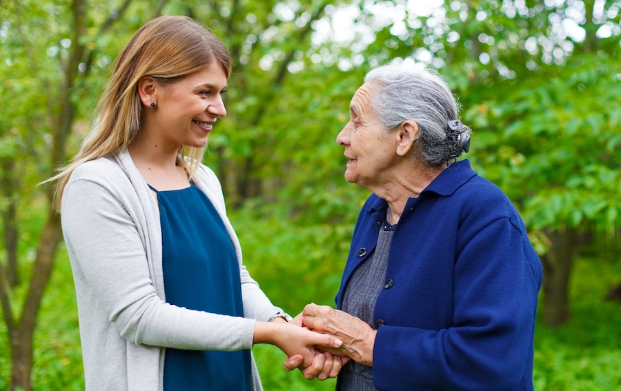 woman talking to grandmother with dementia