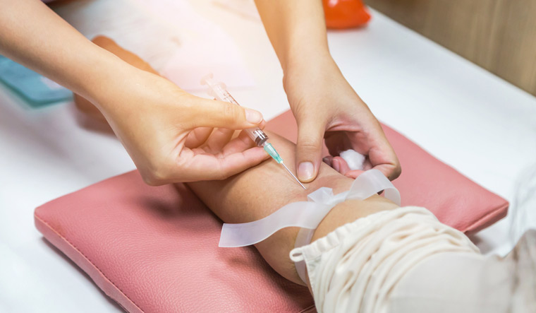 blood test sample nurse pricking needle lab test medical syringe arm shut