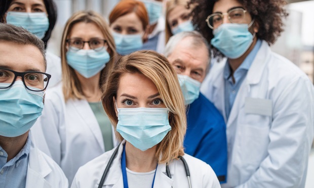 doctors with face masks resize