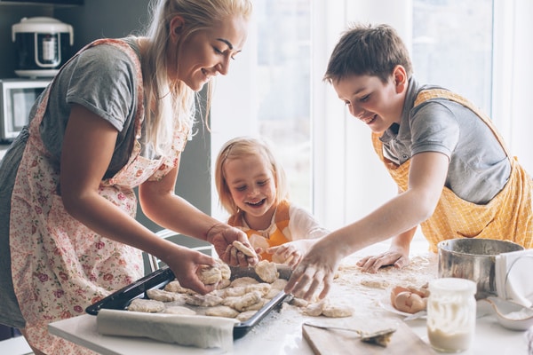 parent and children cooking together