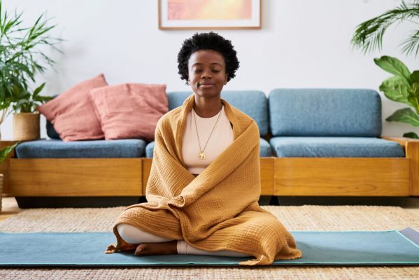 young woman meditating self care plan e1675066731641