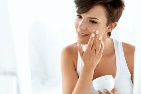 beauty skin care. beautiful happy woman applying cosmetic cream on clean face. 770x514 1 e1639052061355